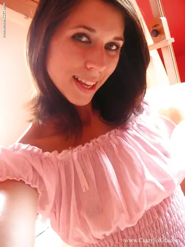 Slim Brunette Peels Off Her Clothes and Spreads Her Pussy