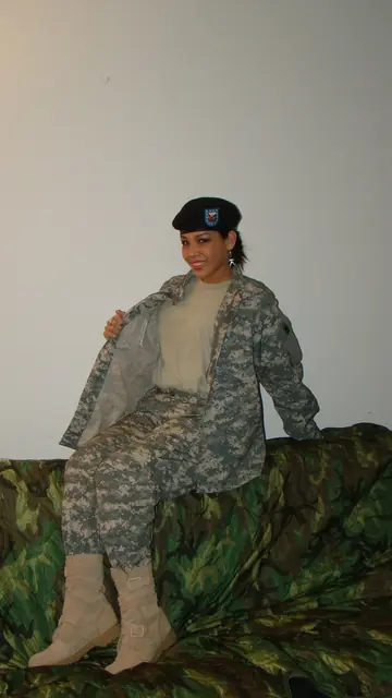 Woman Strips Off Her Combat Uniform and Poses in Panties