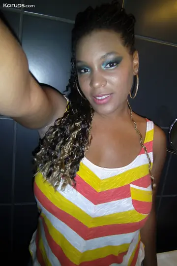 Curly Ebony Babe Flaunts Her Big Tits and Bubble Ass in Selfie