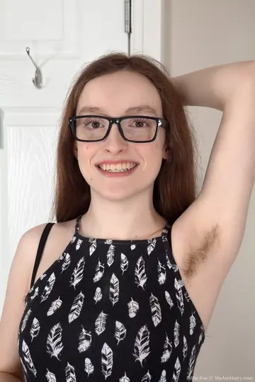 Busty Redhead in Glasses Spreads Her Hairy Pussy