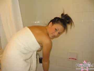 Brunette Strips Nude in the Bathroom