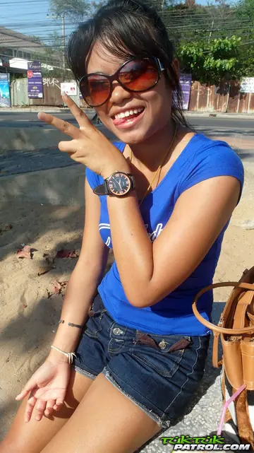 Thai Beauty in Glasses Strips and Spreads Outdoors
