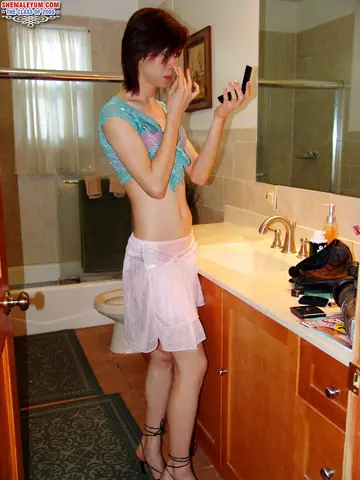 Slim Asian Trans Woman Strips Off Her Top and Poses Nude