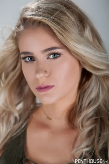 Slim Curly Blonde Shows Off Her Big Pierced Tits in Lingerie