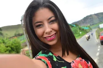 Latina Brunette Bares Her Natural Tits and Oils Them Outdoors