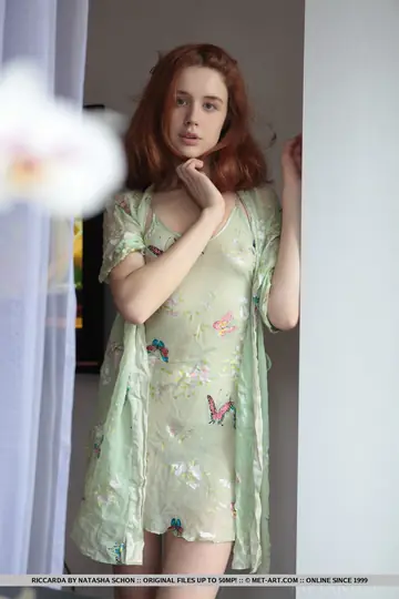 European Redhead Strips Off Her Sheer Dress and Poses Nude