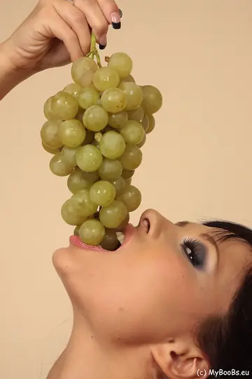 Busty Latina MILF Undresses While Eating Grapes