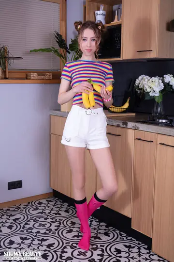 Woman with Small Tits Peels Banana and Strips Out of Her Shorts and Socks