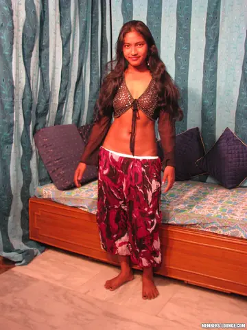 Indian Brunette Undresses to Show Her Shaved Pussy