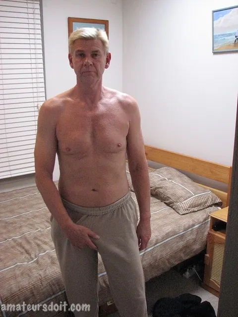 Thick Blonde Guy Jerks His Hard Cock on the Bed – photo 4 of 21