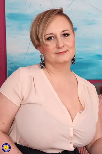 Short-Haired Curvy Mature Woman Undresses to Show Her Big Tits
