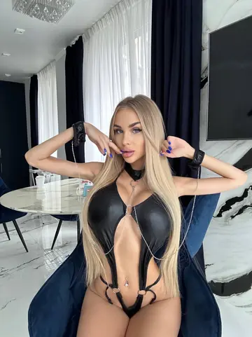 Slim Ukrainian Blonde with Big Tits Poses in Lingerie and a Bikini