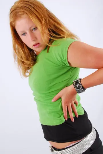 Redhead Poses in a Clothed Session