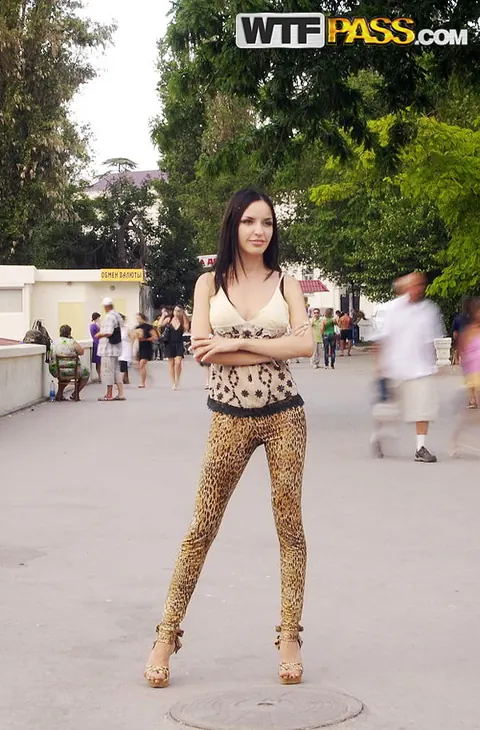 Brunette in Heels and Tight Pants Poses Outdoors – photo 10 of 16