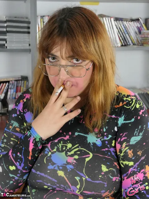 Thick Redhead in Glasses Spreads Her Shaved Pussy While Smoking – photo 16 of 16