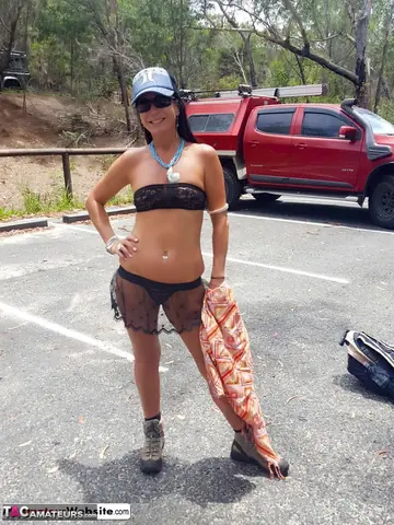 Brunette MILF Lifts Her Skirt and Flashes Her Shaved Pierced Pussy Outdoors