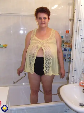 Curvy Mature Housewife Strips Nude in the Bathroom