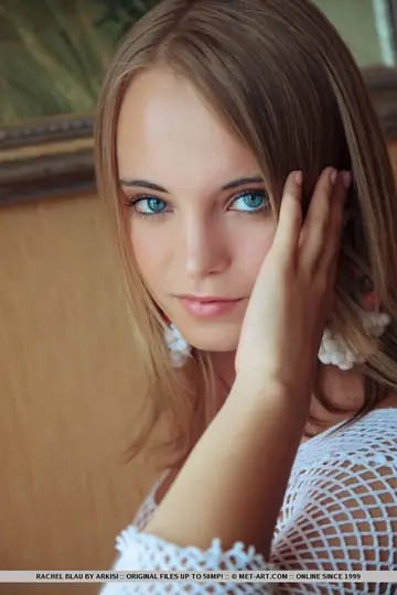 Slim European Blonde in Fishnet Spreads Her Shaved Pussy