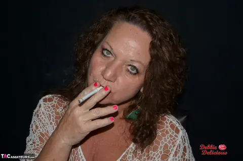 Debbie Delicious: Thick Mature Brunette Smokes in Leather Before Fingering – photo 4 of 20