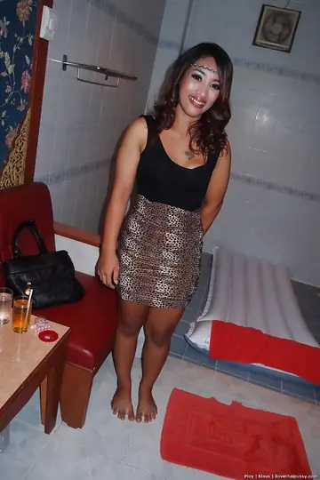 Thick Asian Woman in a Skirt Spreads Her Pussy in the Bathroom