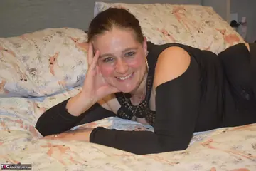 Mature BBW in Stockings Shows Her Big Tits on the Bed