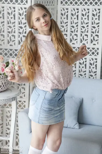 Redhead in Pigtails Lifts Her Skirt and Spreads Her Pussy