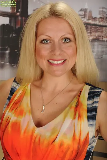 Blonde MILF Undresses and Spreads Her Pussy