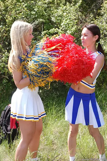 Two Women in Skirts Have Lesbian Sex with a Toy Outdoors