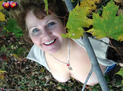 Bustybliss: Mature Curvy Brunette Undresses Outdoors Under a Tree – photo 10 of 20