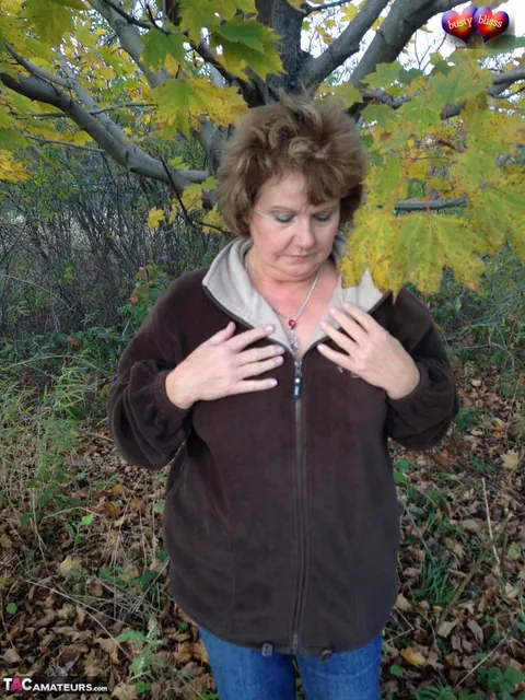 Bustybliss: Mature Curvy Brunette Undresses Outdoors Under a Tree – photo 2 of 20