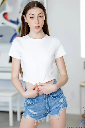 Tiana Blow – Slim Brunette in Jeans and Socks Spreads Her Trimmed Pussy