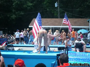 Blonde Strips Naked and Spreads Her Legs on an Outdoor Stage