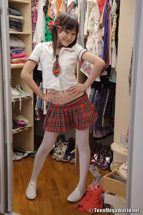 Asian Woman in Uniform Strips and Masturbates in Pigtails – photo 13 of 21