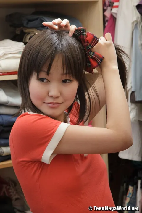 Asian Woman in Uniform Strips and Masturbates in Pigtails – photo 1 of 21