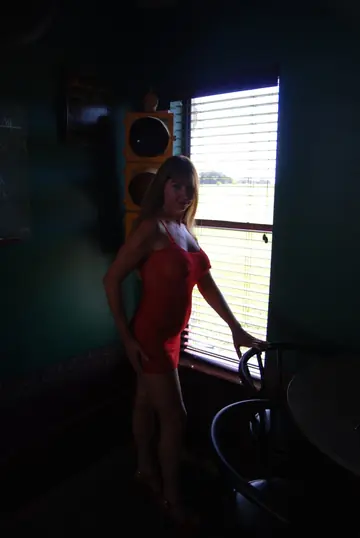 Mature Redhead Spreads Her Shaved Pussy in a Red Dress