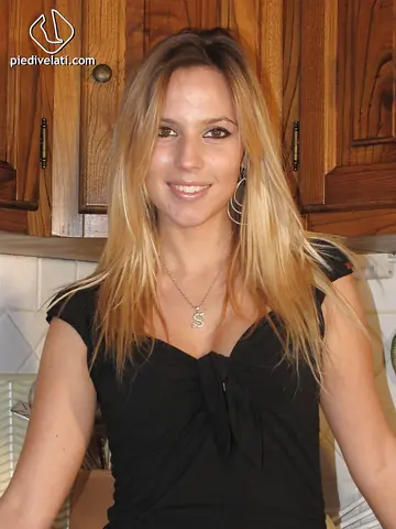 Blonde in Pantyhose and Shorts Poses for Foot Fetish