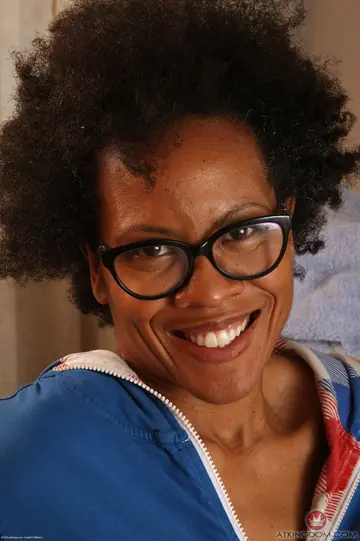 Mature Ebony Woman in Lingerie and Glasses Spreads Her Hairy Pussy