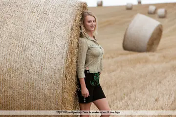 European Blonde with Big Tits Undresses by a Hay Bale