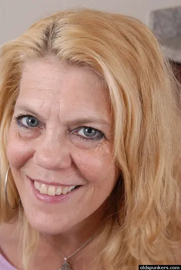 Mature Blonde Flaunts Her Big Natural Tits in Lingerie