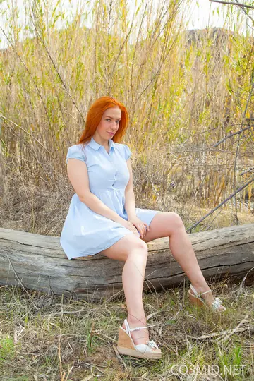 Busty Redhead Strips Out of Her Lingerie Outdoors