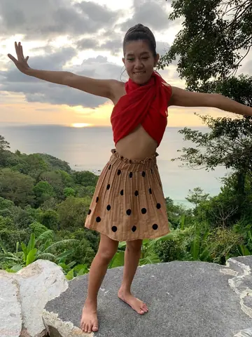 Petite Asian Woman Strips Out of Her Skirt Outdoors