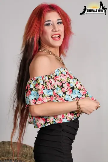 Redhead Trans Woman in a Skirt and Heels Poses in Pantyhose