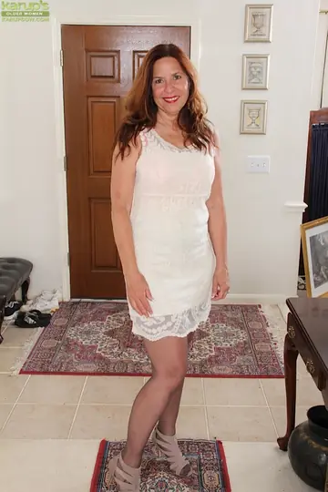 Mature Redhead Strips Off Her Lingerie and Pantyhose to Spread Her Hairy Pussy