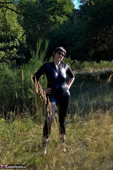 European MILF Unzips Her Latex Bodysuit Outdoors