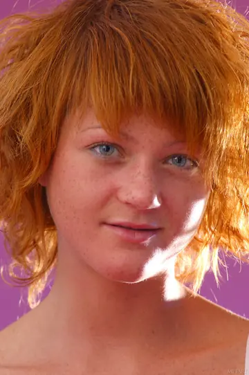 Short-Haired Redhead Spreads Her Pussy