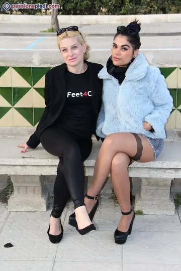 Two Women in Pantyhose Kiss and Play with Feet Outdoors
