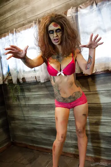 Kleio Valentien – Busty Tattooed MILF Strips Out of Her Zombie Costume and Lingerie