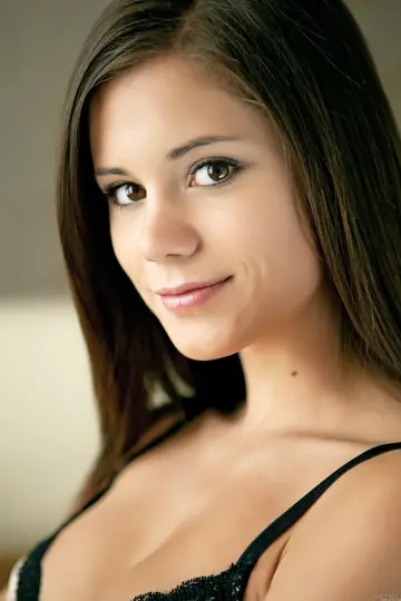 Petite Brunette Poses Naked on a Leather Sofa