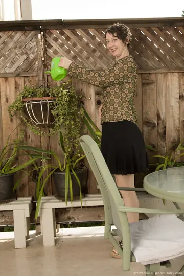 Pale Short-Haired Brunette Shows Her Hairy Bush on Patio