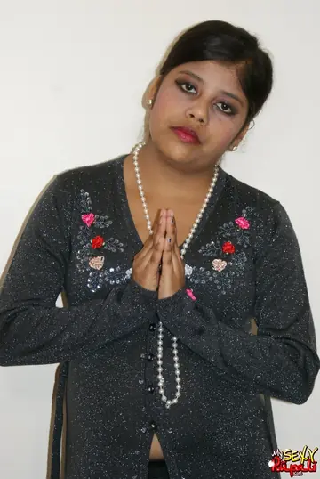 Indian Woman Sits Cross-Legged and Displays Her Nude Body